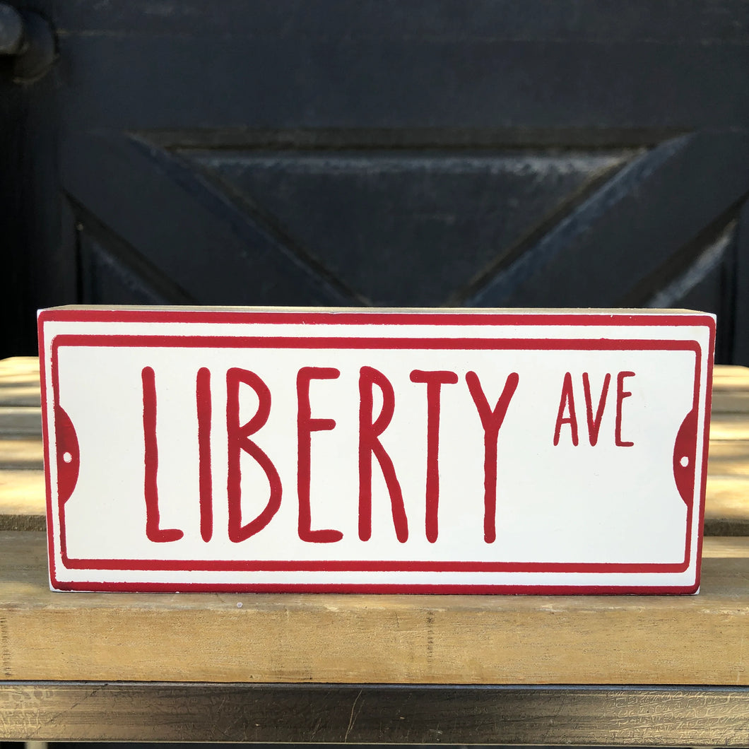 Liberty Ave Sitter Sign